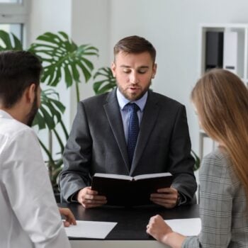 Couple sat with solicitor going through divorce